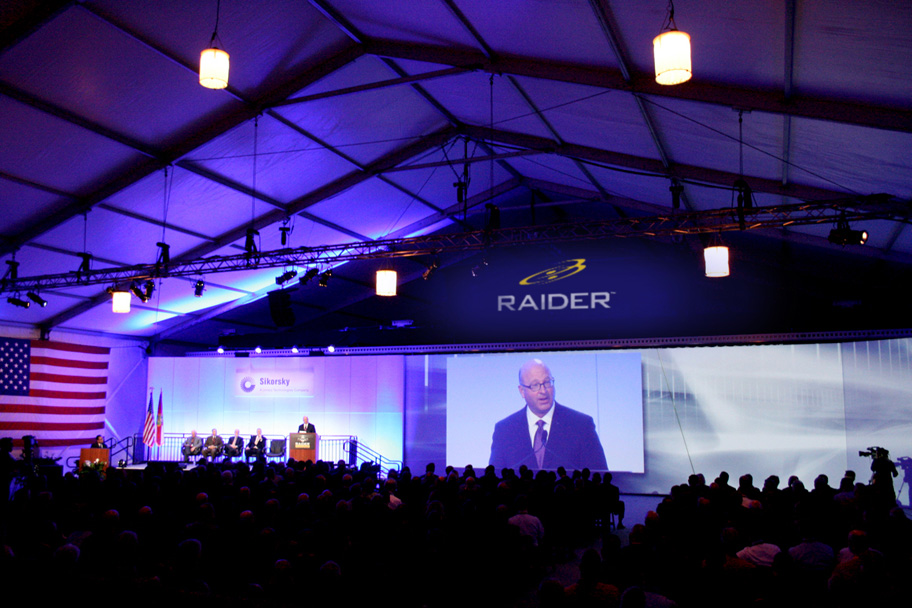 The stage and large screen presentation of the S-97 Raider with VIP's and media support.